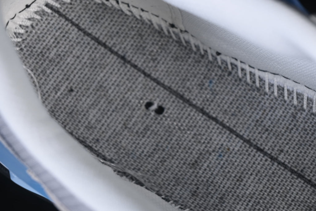 Close-up of the textured grey upper and stitching