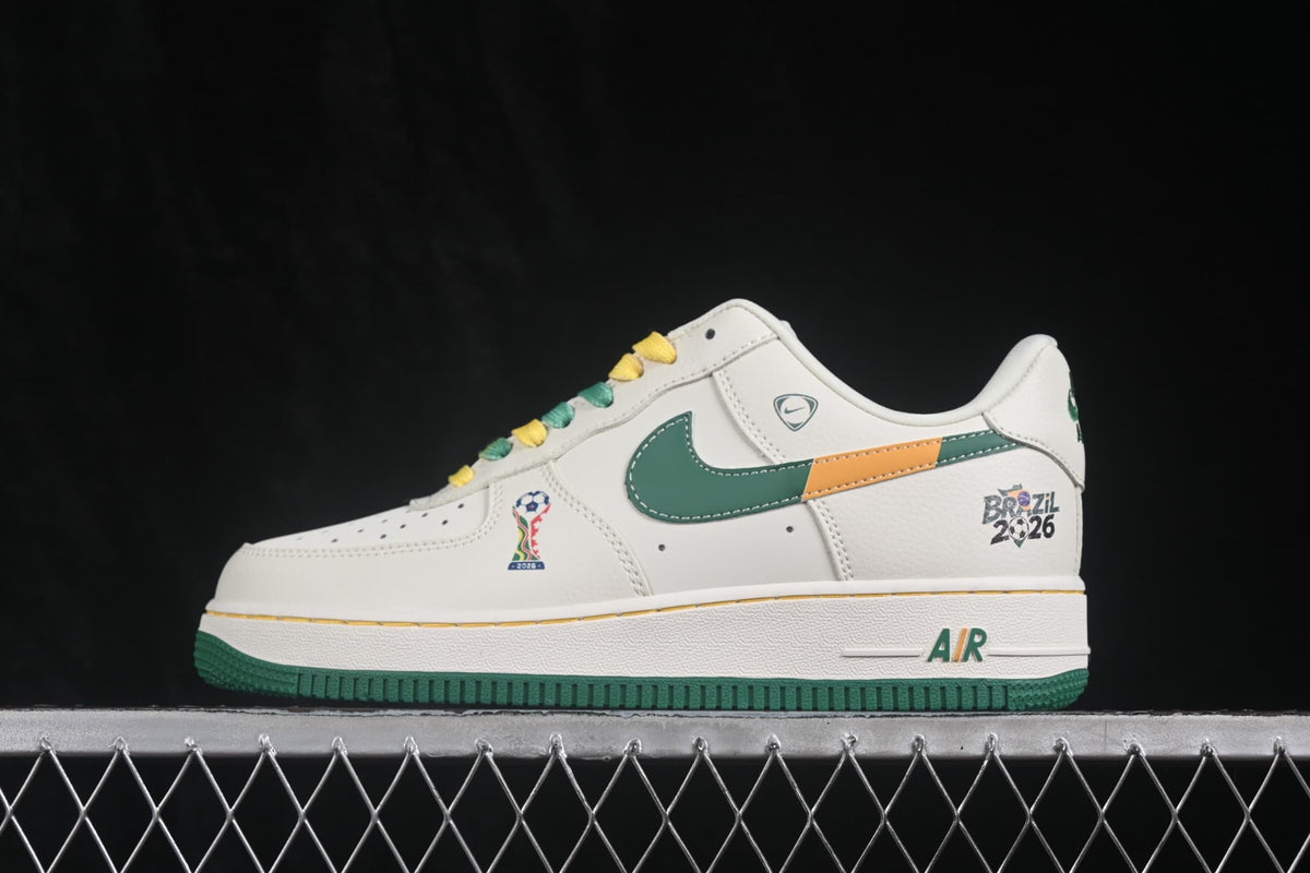 Side profile showing the white low-top upper, green Swoosh, orange accent, AIR detail, and green outsole.