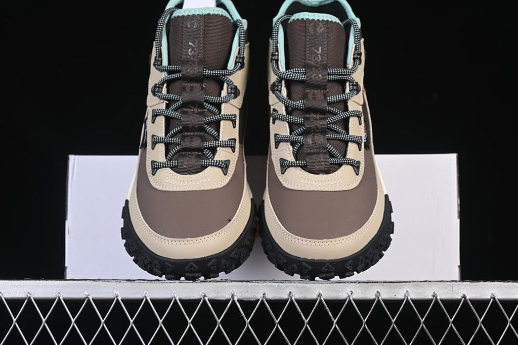 Front view of the pair showing the round toes and patterned laces