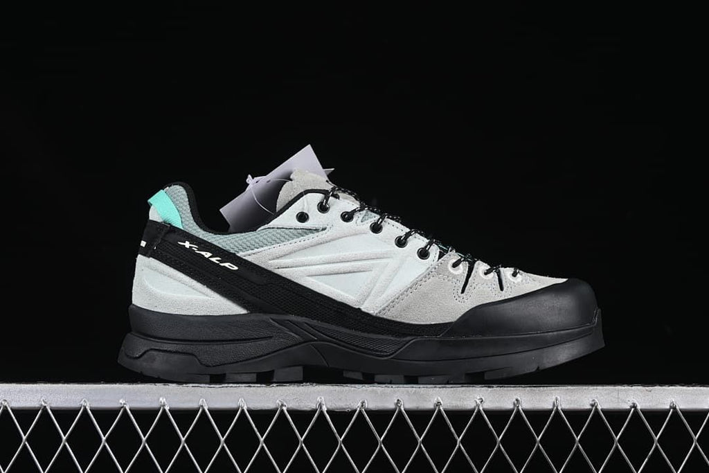 Side profile of the X-ALP shoe with its protective toe and layered sole.