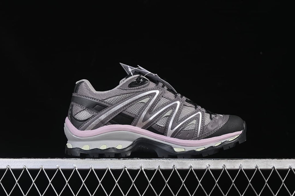 Side profile of the grey and plum-pink trail shoe