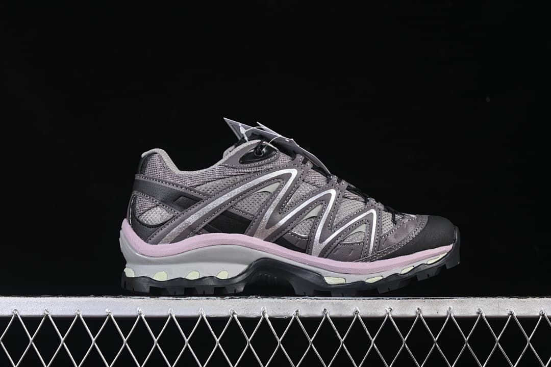 Side profile of the grey and plum-pink trail shoe