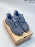 Pair of gray Nike Pegasus Trail 6 shoes displayed on a Nike Trail box
