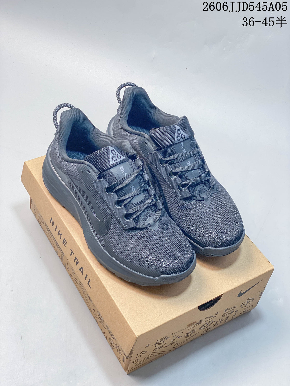 Pair of gray Nike Pegasus Trail 6 shoes displayed on a Nike Trail box