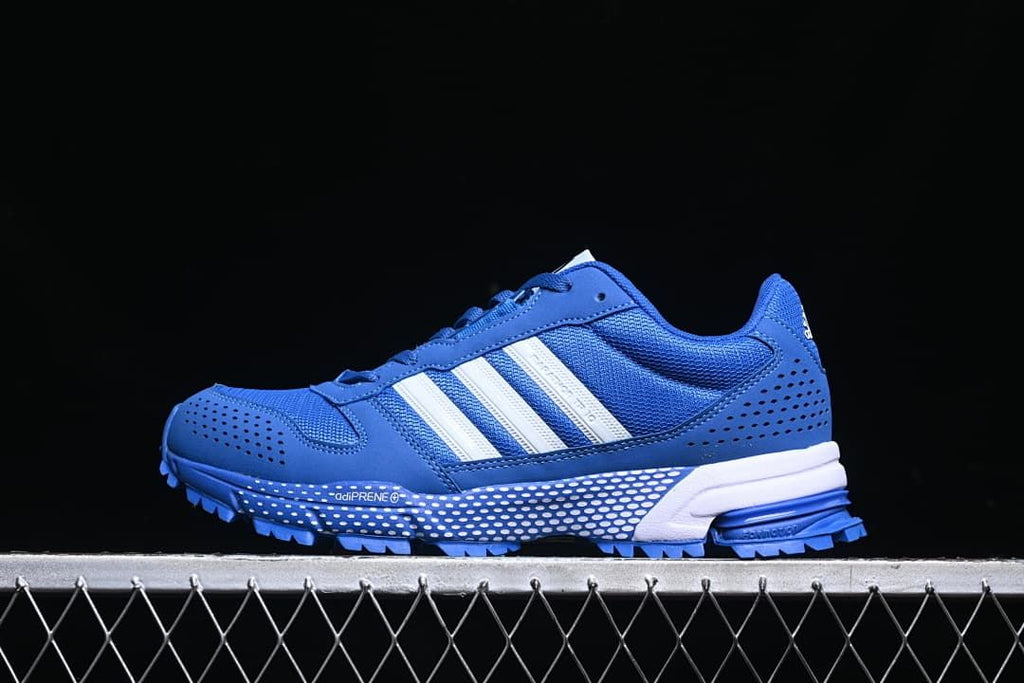 Side profile of the blue sneaker with mesh panels and lugged outsole