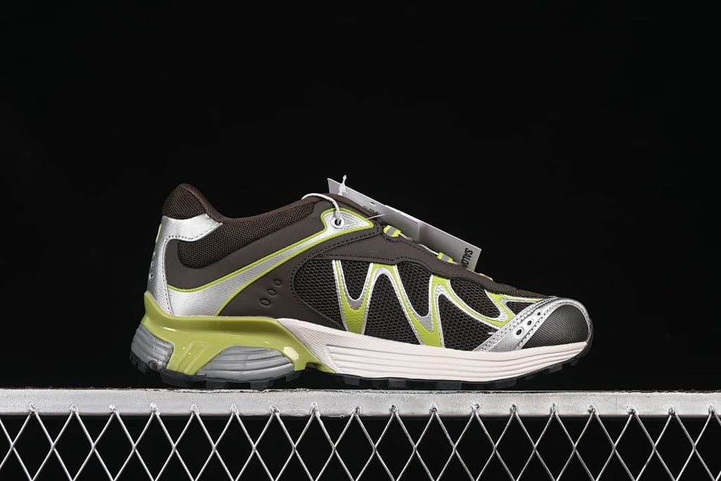 Side profile of one sneaker showing the brown, silver, and lime colorway