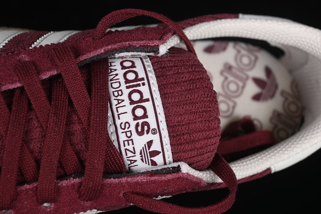 Close-up of the Handball Spezial tongue label and burgundy laces