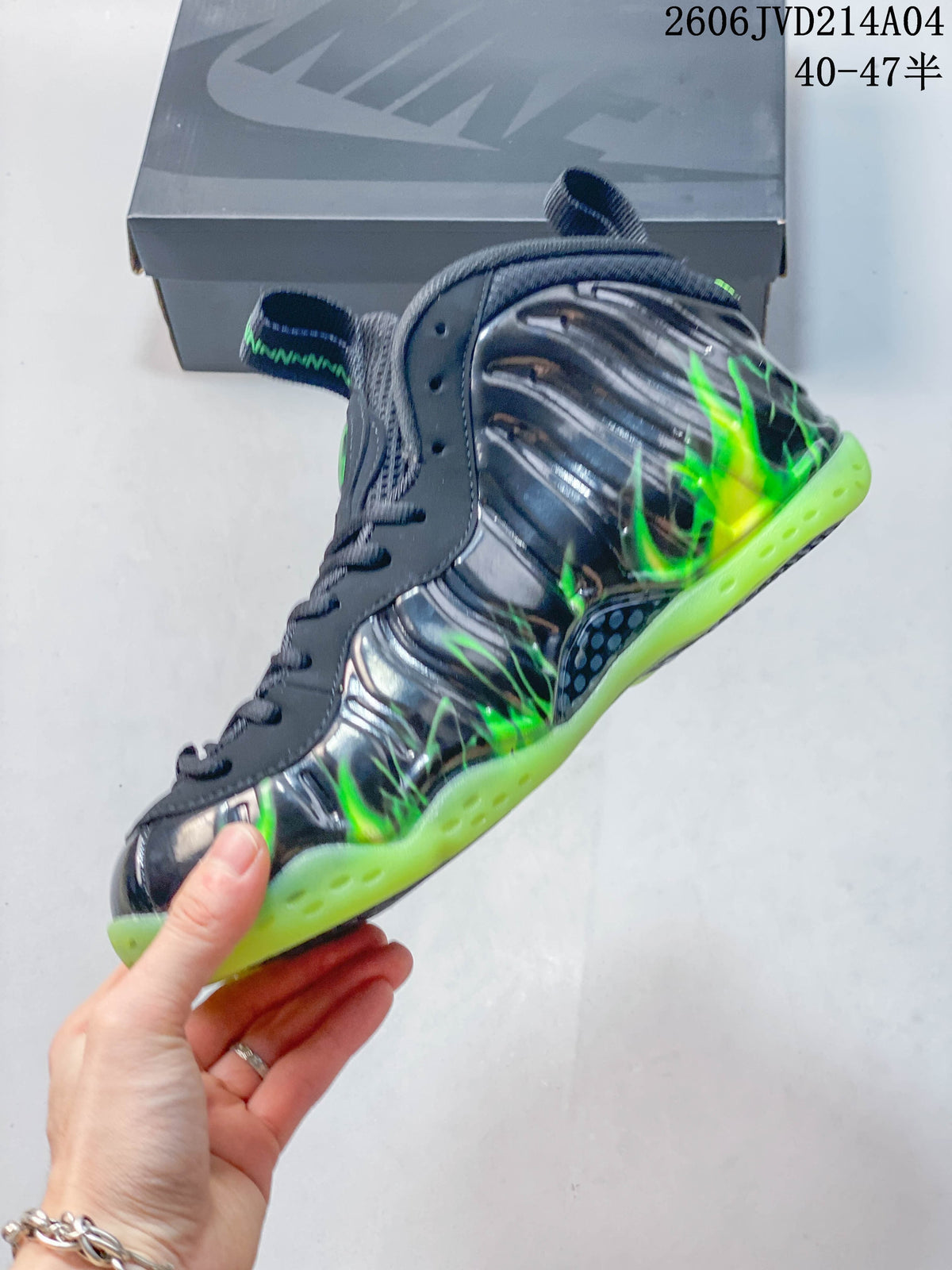 Side profile showing sculpted gray panels, bright green details, and a green outsole.