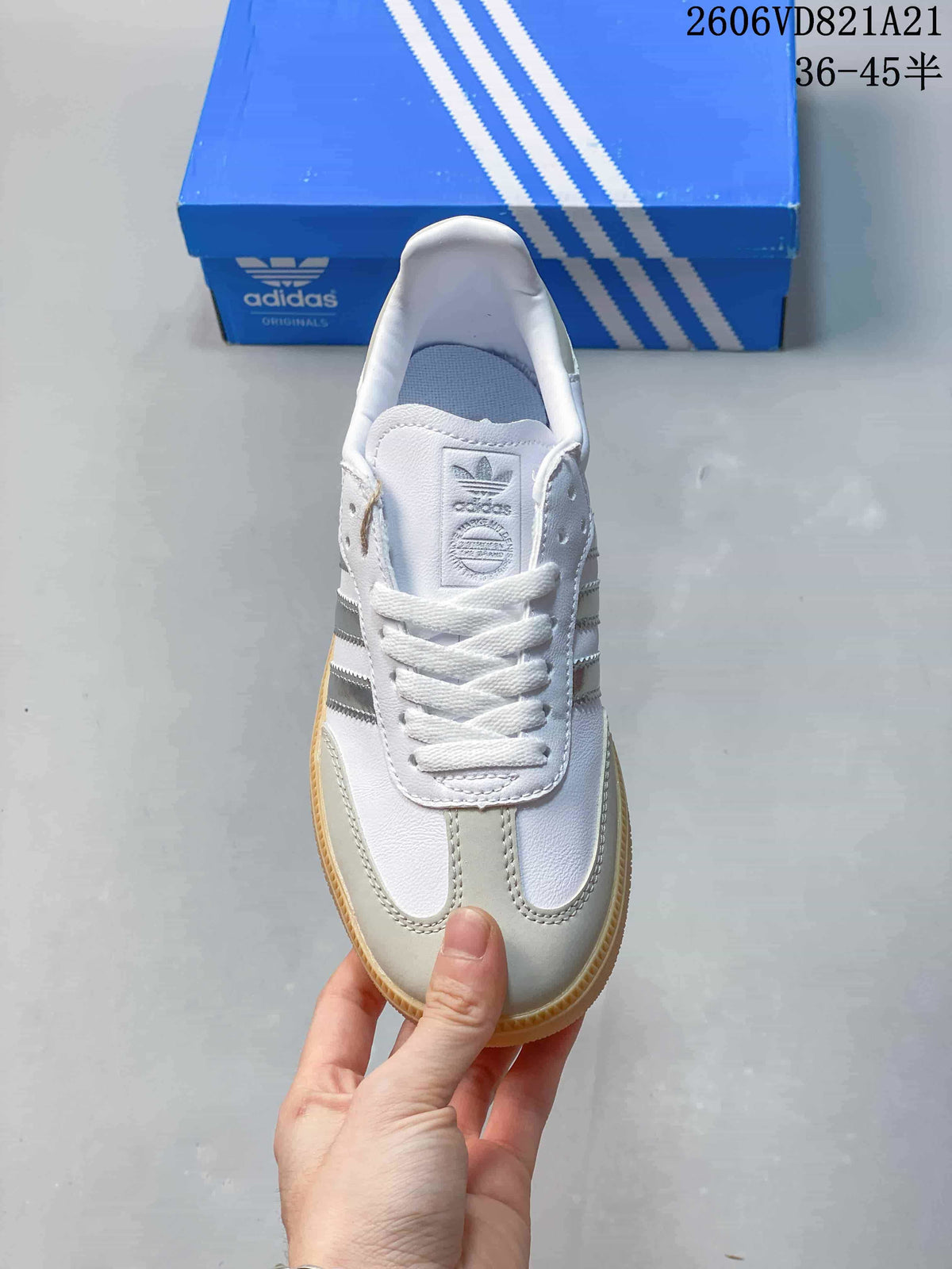 Top view of a white low-top sneaker with light gray overlays and white laces.