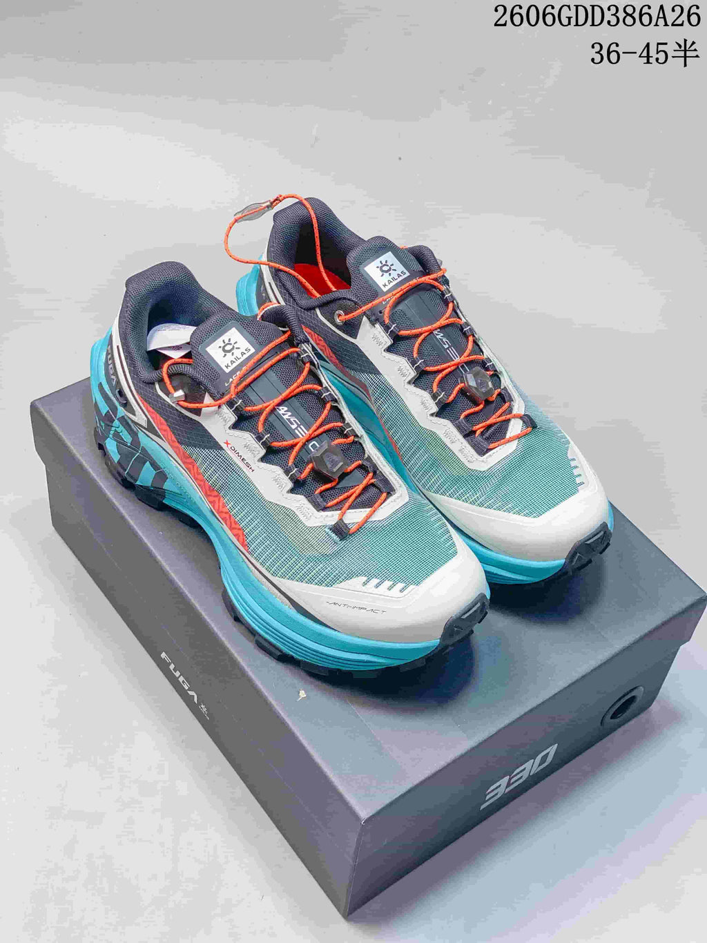 Gray and turquoise KAILAS FUGA EX330 trail shoes with orange laces