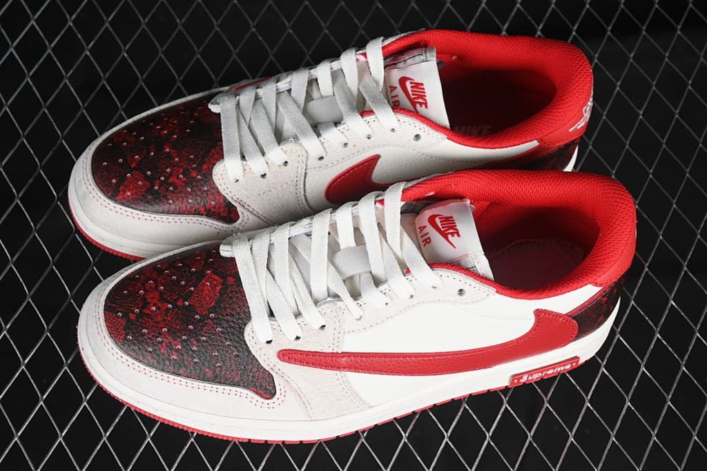 Pair of red, white, and dark patterned low-top sneakers viewed from above.