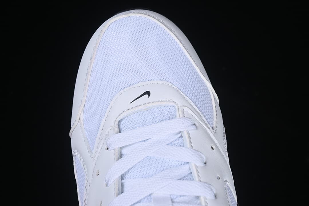 Top view of the white mesh-look toe and lace area.