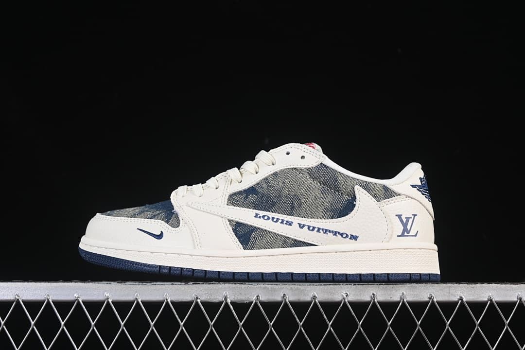 Side view of a low-top sneaker with off-white panels, blue patterned sections, and a dark outsole.