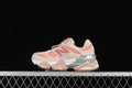 Side view of beige and pink New Balance kids' sneakers