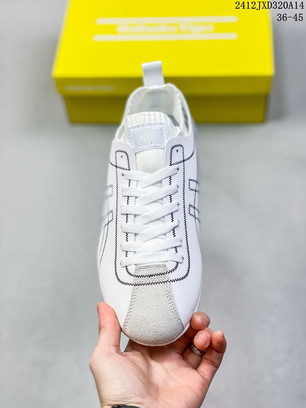 Front view showing white laces, a gray toe accent and black stitched detailing