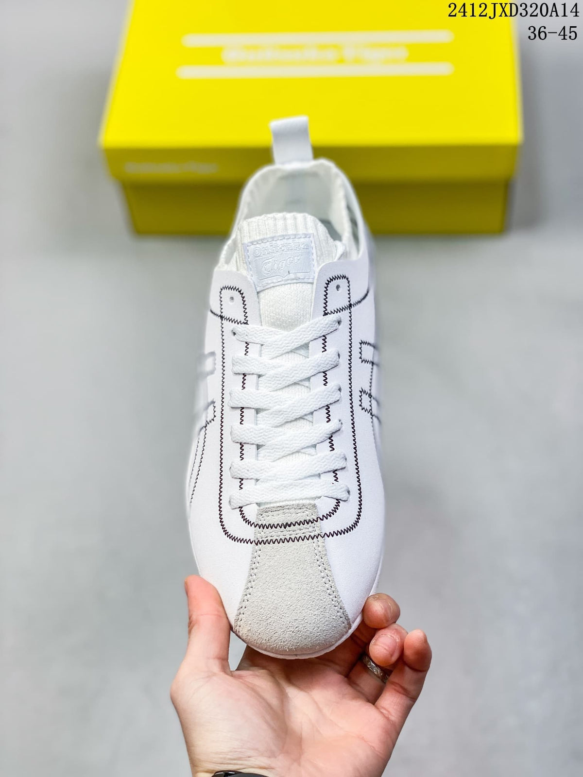 Front view showing white laces, a gray toe accent and black stitched detailing