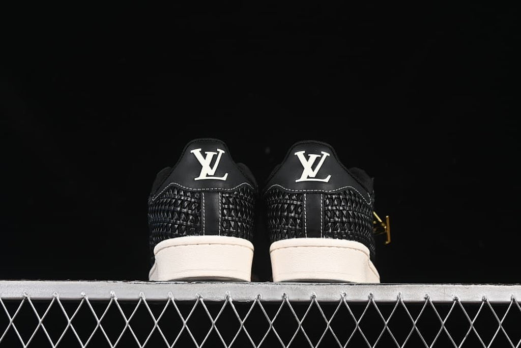 Rear view of the pair showing heel details and off-white soles