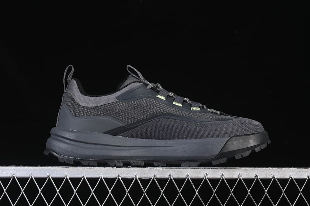 Side profile of a dark gray low-cut outdoor shoe