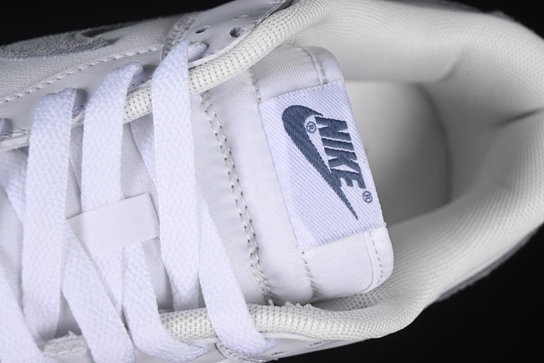 Close-up of the white laces, tongue label, and padded collar