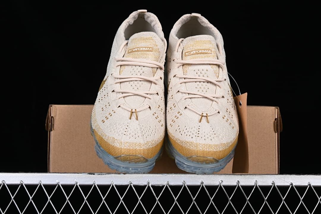 Front view of the pair showing knit uppers and clear soles.