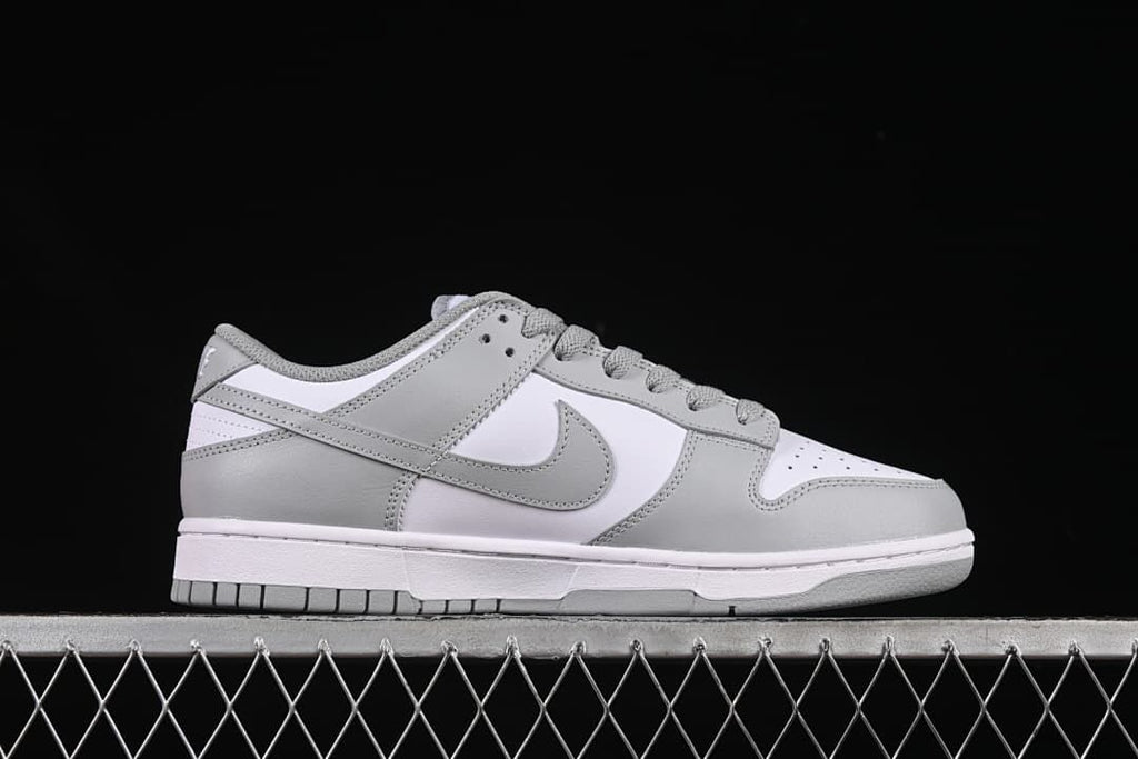 Side profile of the white and grey low-top sneaker