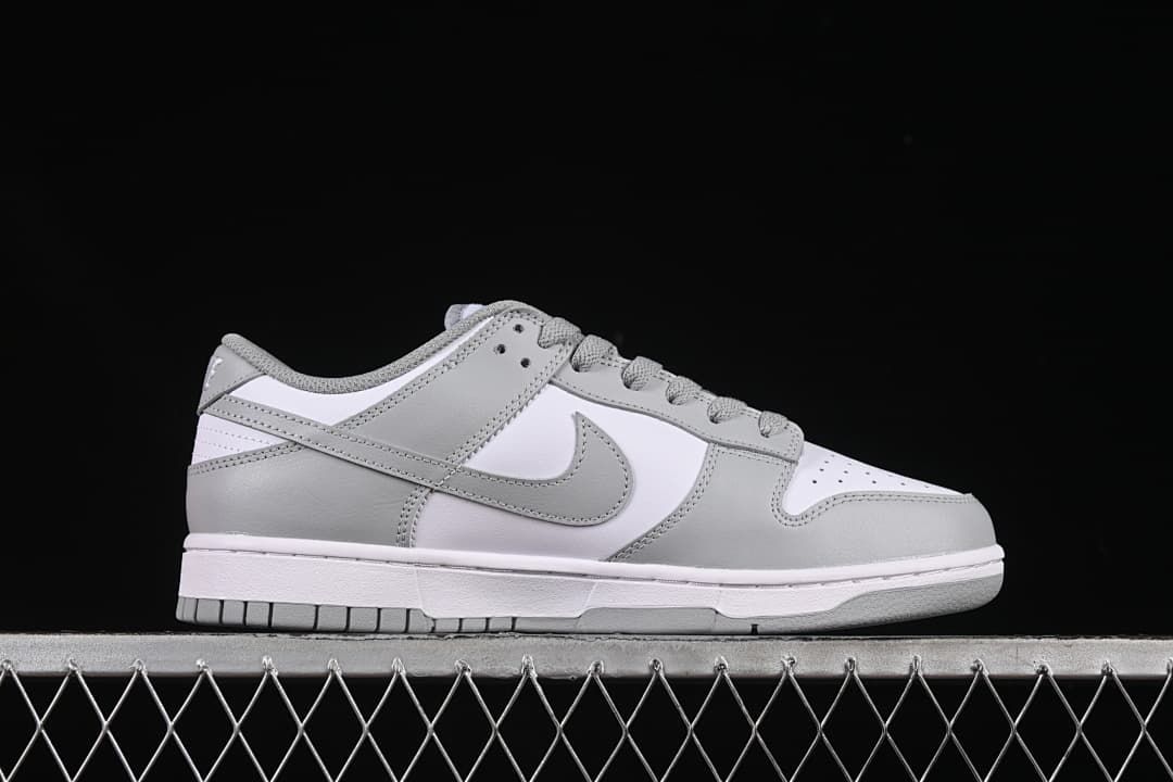 Side profile of the white and grey low-top sneaker