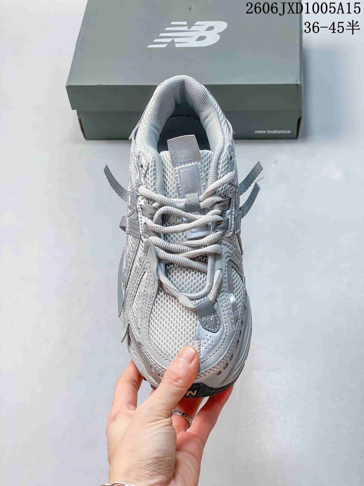 Top view of a silver-grey sneaker with mesh panels and lace-up fastening
