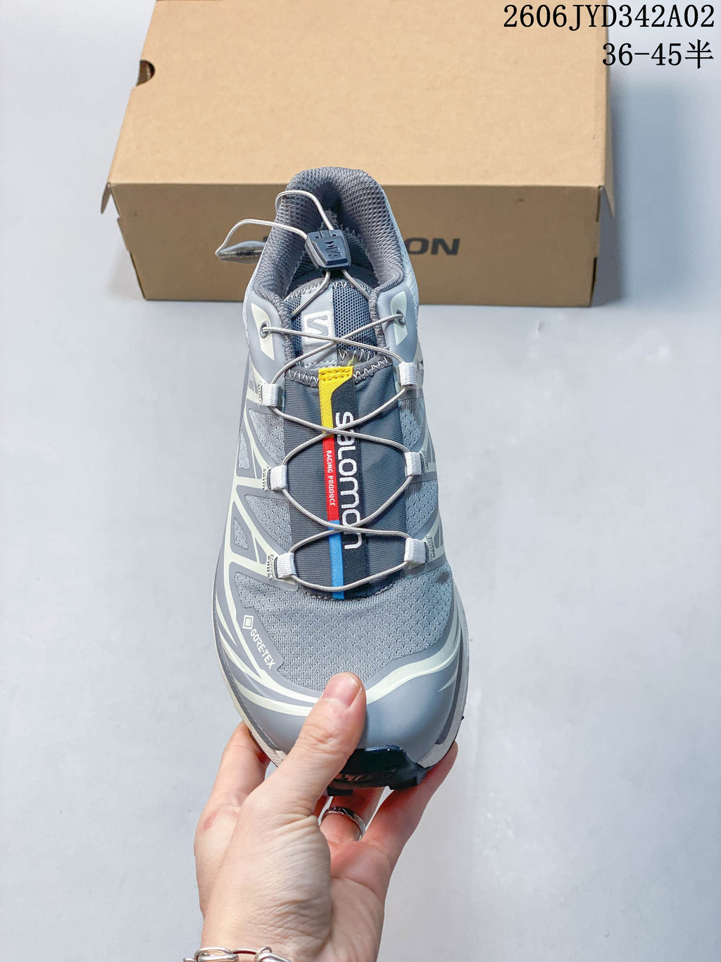 Top view of a gray Salomon trail running shoe showing its quick-lace closure
