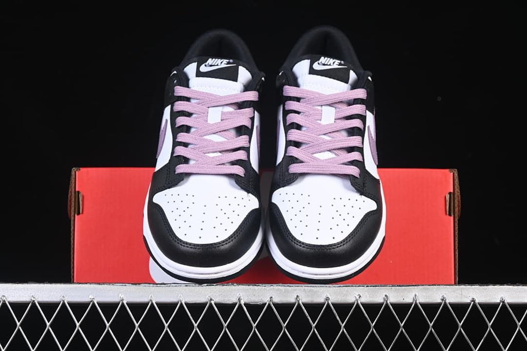 Front view of the pair showing perforated toes and purple laces