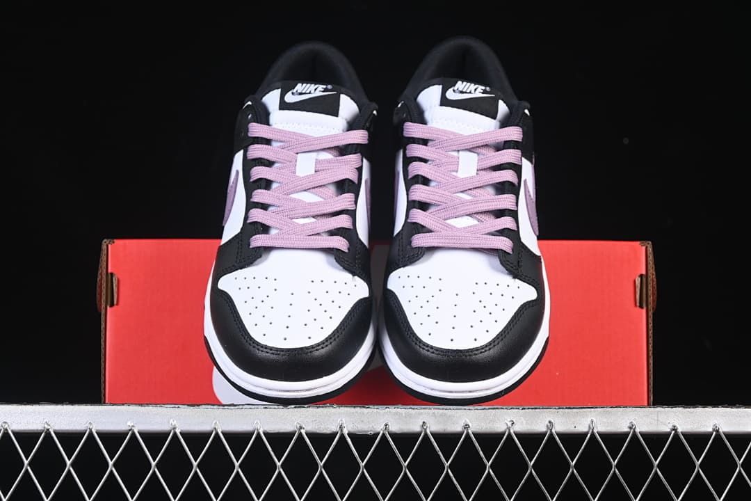 Front view of the pair showing perforated toes and purple laces