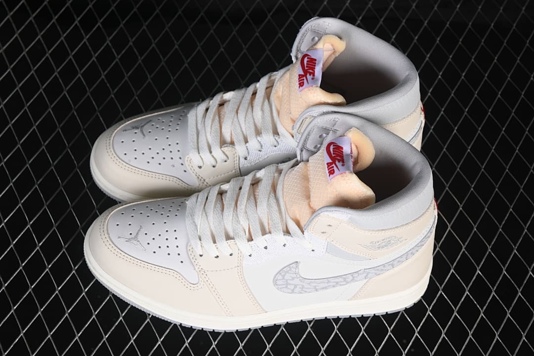 Pair of ivory and white high-top sneakers viewed from above
