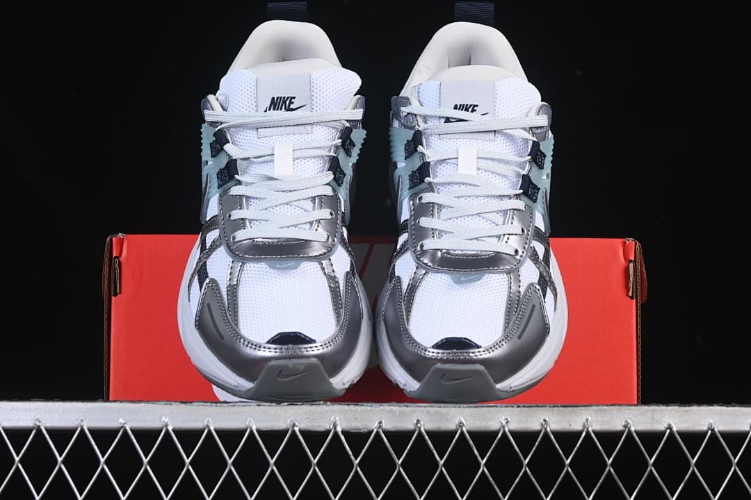 Front view of the pair showing the toe shape, laces, and layered panels.