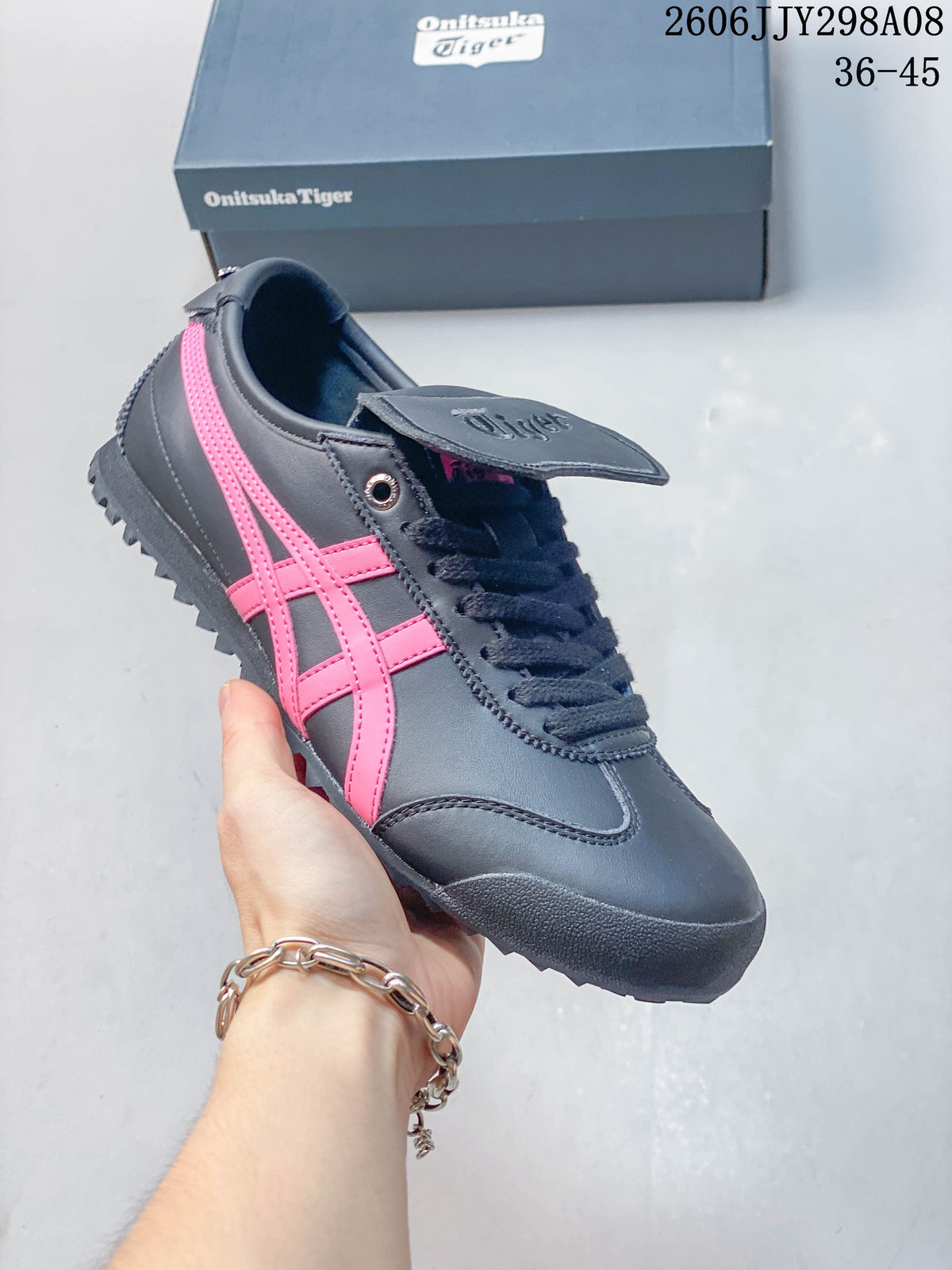 Charcoal Onitsuka Tiger Mexico 66 Golf sneaker with bright pink side stripes.