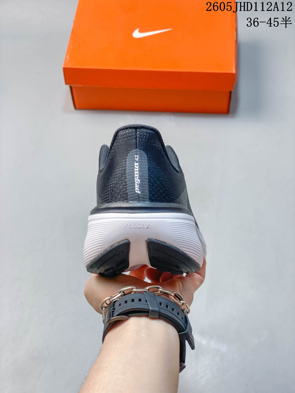 Rear view of the shoe showing the heel and white midsole