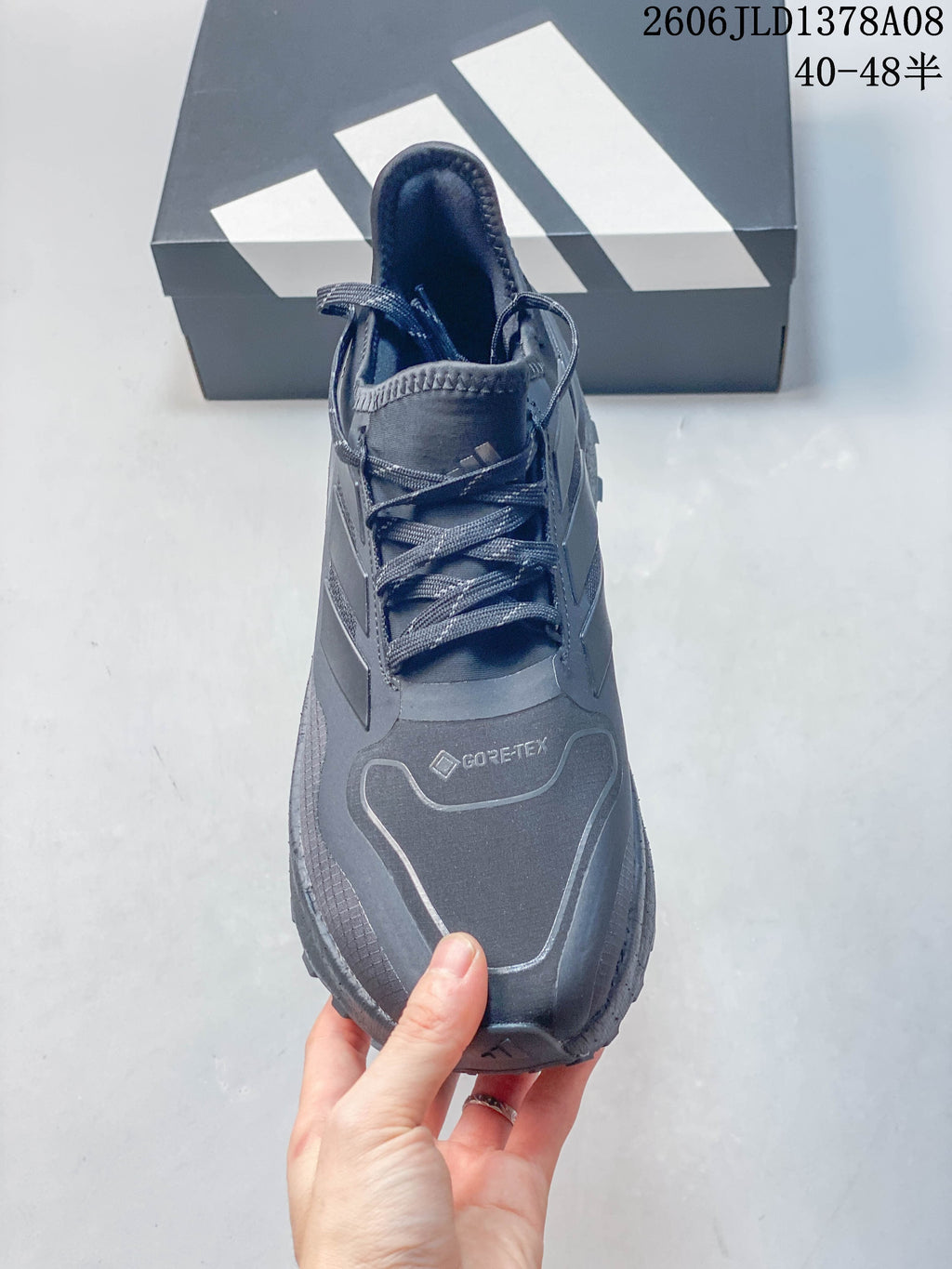 Front view showing the laces and reflective-looking toe outline