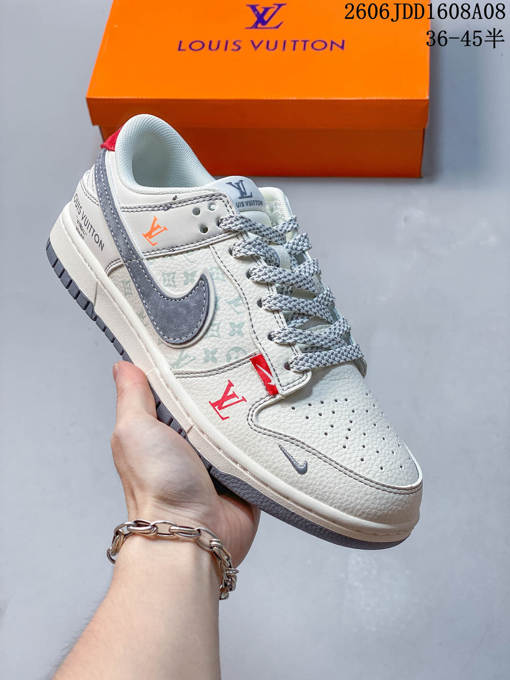 Angled side view showing patterned panels, gray Swoosh, and red accents