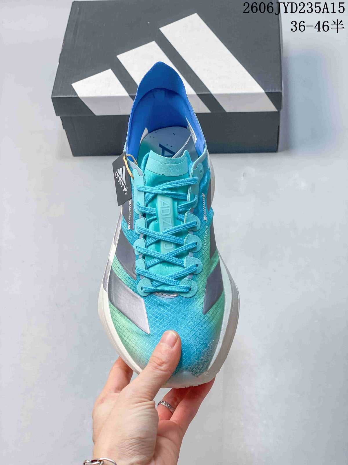 Front view showing the laces, tongue and blue-green upper