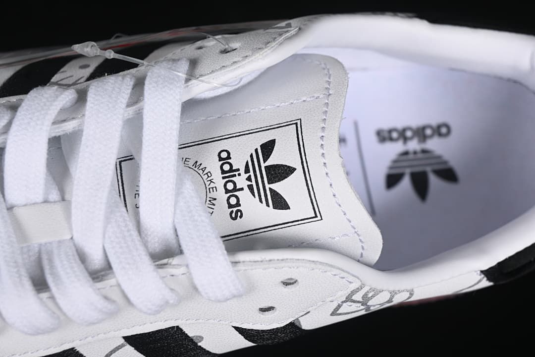 Close-up of the sneaker tongue label and insole branding.