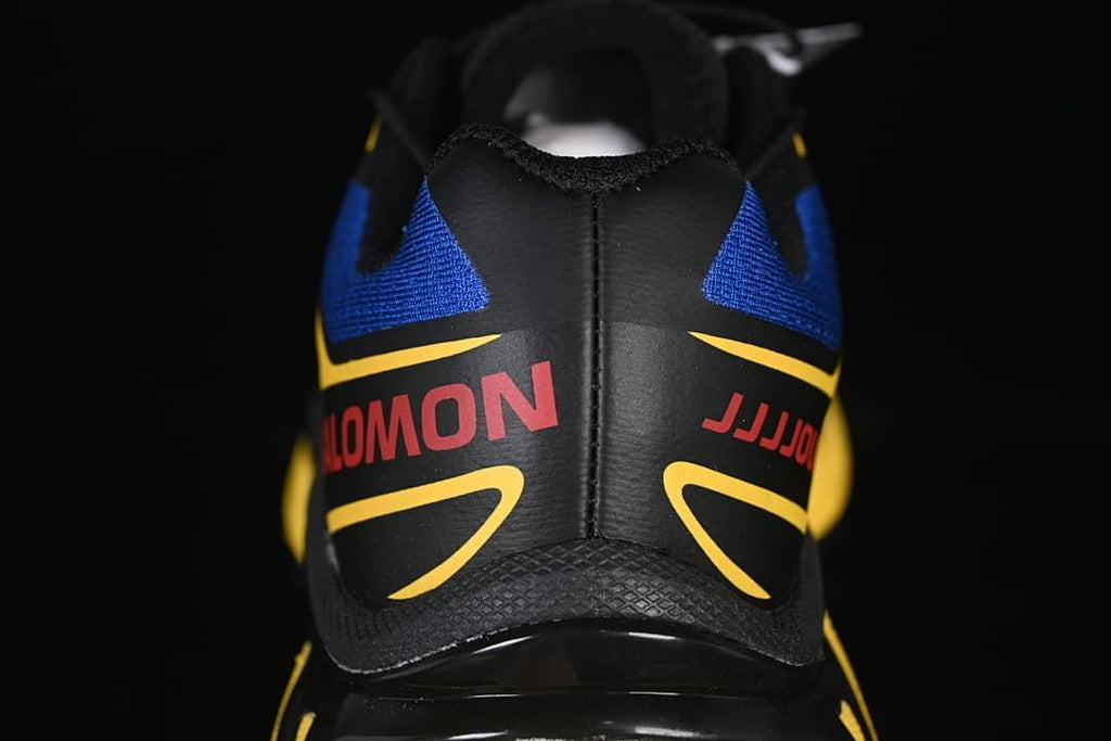 Rear view of the shoe with blue, yellow, and black detailing