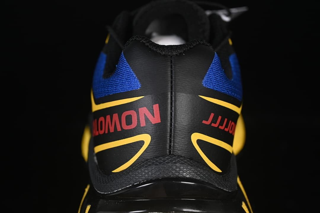 Rear view of the shoe with blue, yellow, and black detailing