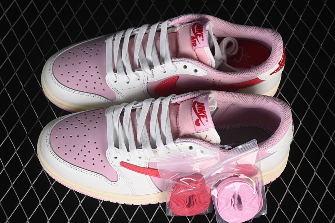 Pair of pink and white low-top sneakers with extra pink and red laces.