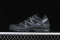 Side view of a black Salomon XT-Quest trail shoe with dark gray overlays.