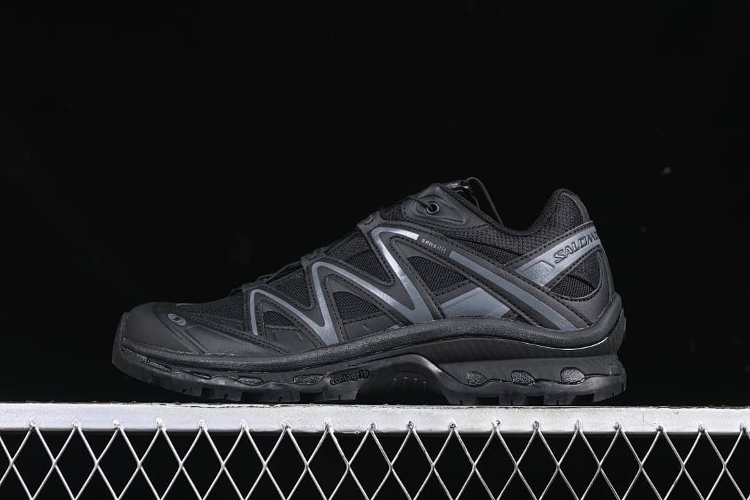 Side view of a black Salomon XT-Quest trail shoe with dark gray overlays.