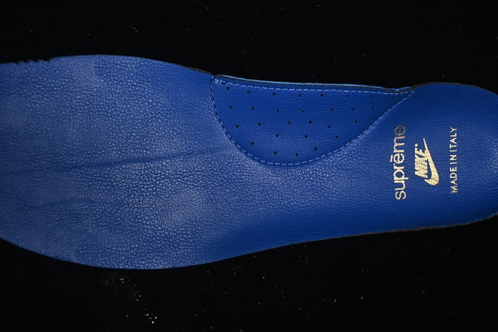 Close-up of the blue insole with Supreme and Nike branding.