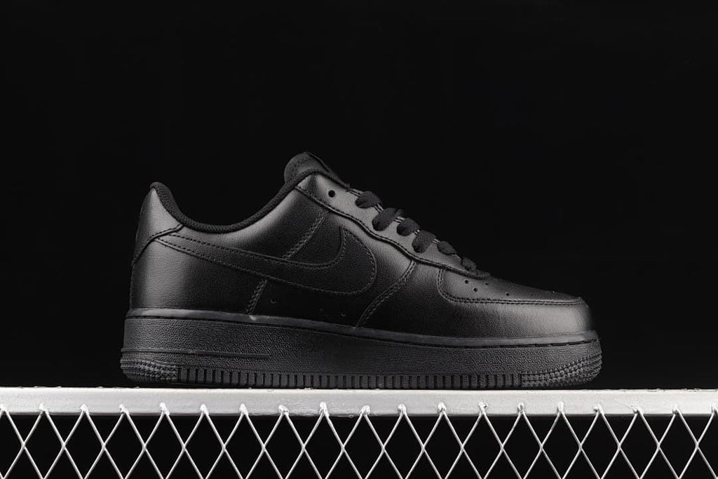 Side profile of an all-black Nike Air Force 1 '07 Low sneaker.