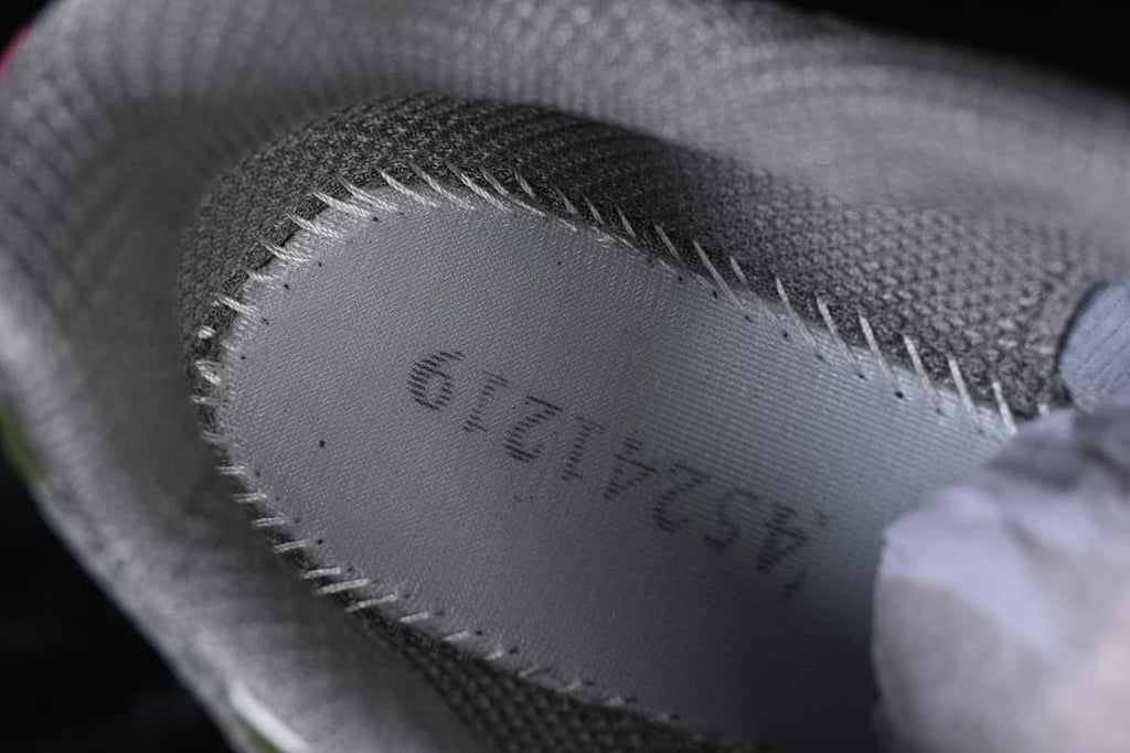 Close-up of the shoe's interior label and gray lining.