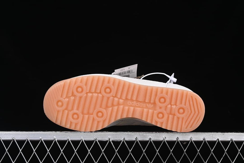 Underside view of the gum-colored outsole and tread