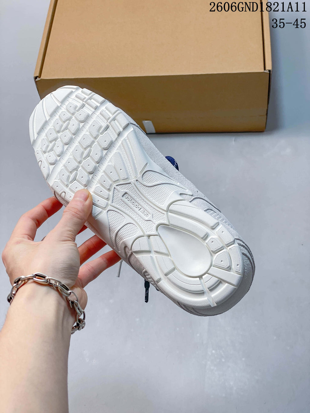 Close-up of the sneaker outsole with a raised geometric tread pattern