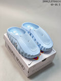 Light blue Nike x NOCTA Mind 001 mule slides displayed on the box