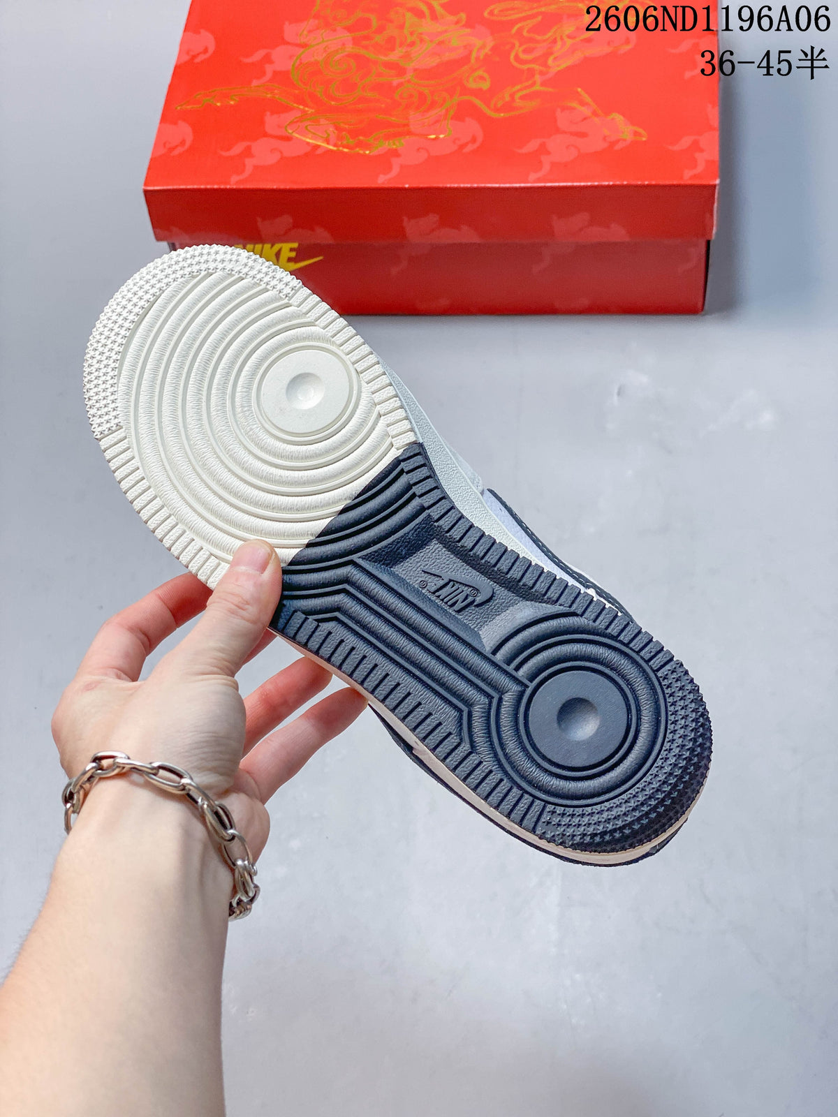 View of the Nike Air Force 1 outsole, showing white and dark navy sections.